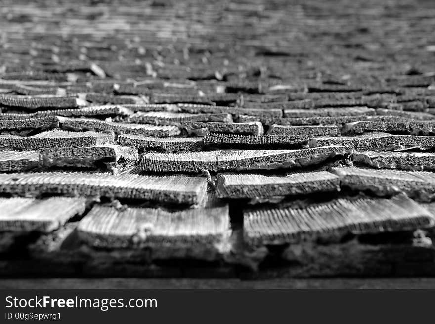 Close up of old, worn shingles lin black and white to complete the mood. Close up of old, worn shingles lin black and white to complete the mood