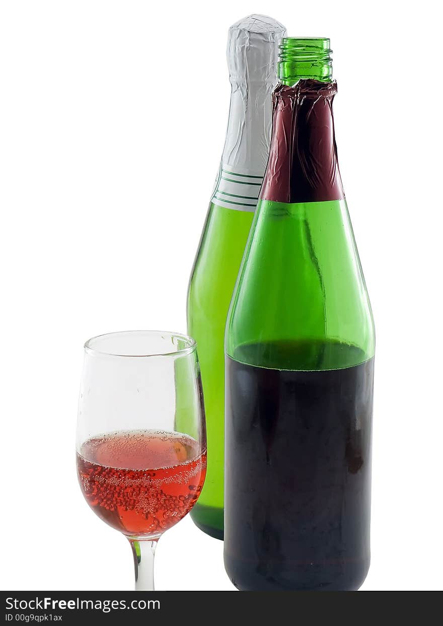 Two bottles of wine and a glass of wine isolated on white