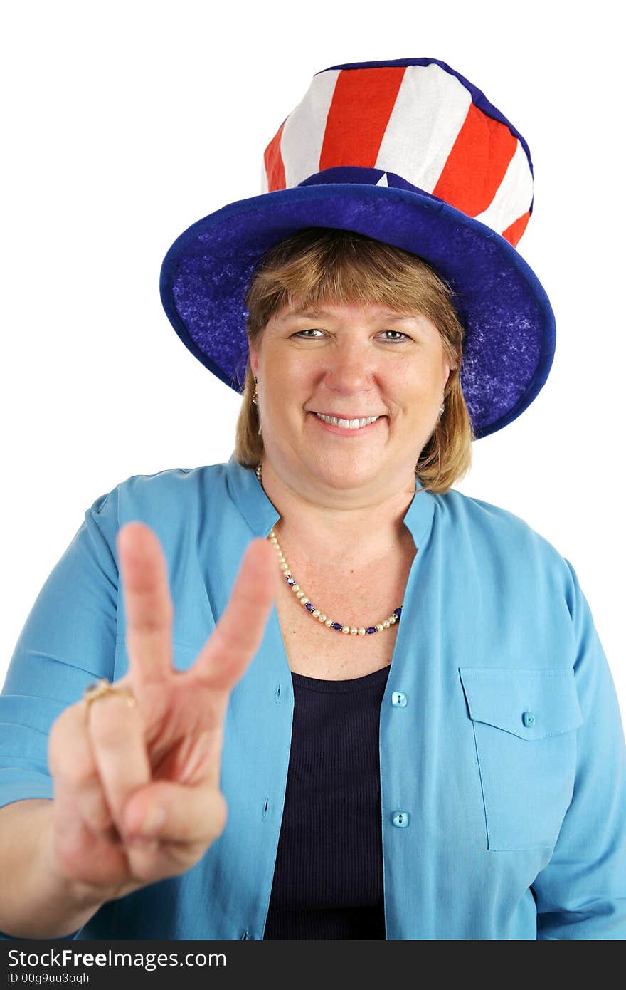 A US military wife wearing a patriotic party hat and flashing a peace sign.  Isolated on white. A US military wife wearing a patriotic party hat and flashing a peace sign.  Isolated on white.