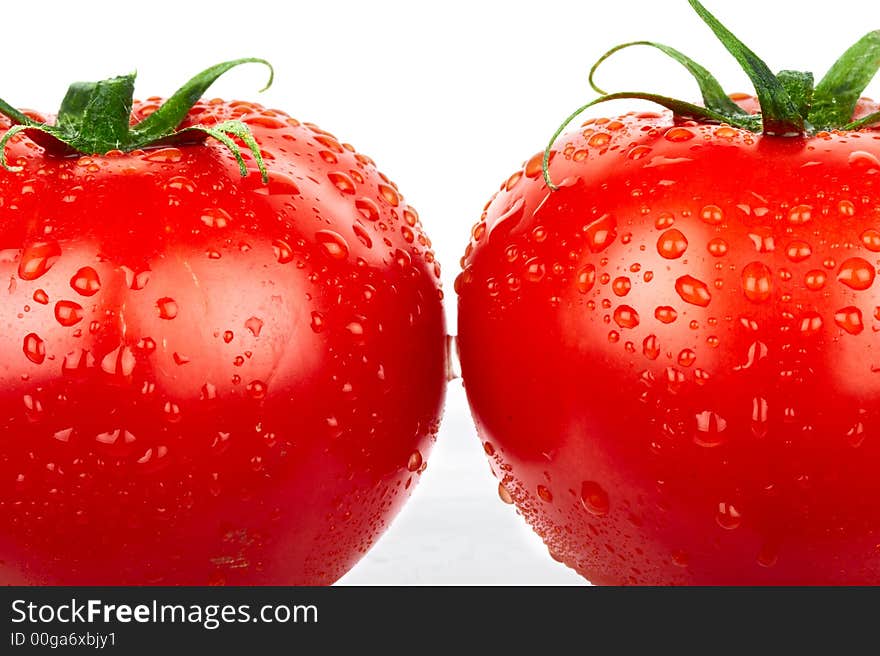 Red tomatoes. Isolated over white background