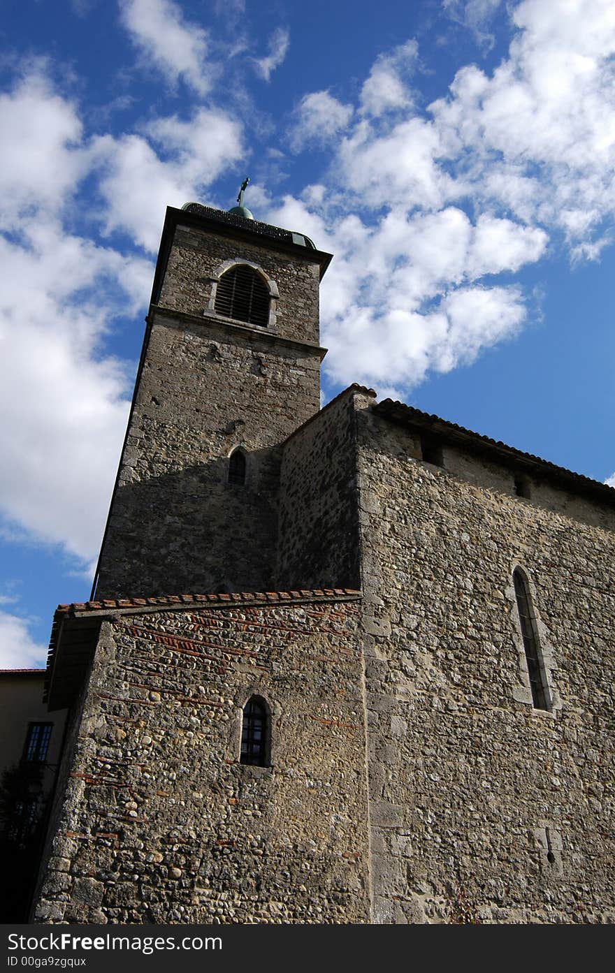 Medieval tower on a background of the blue sky