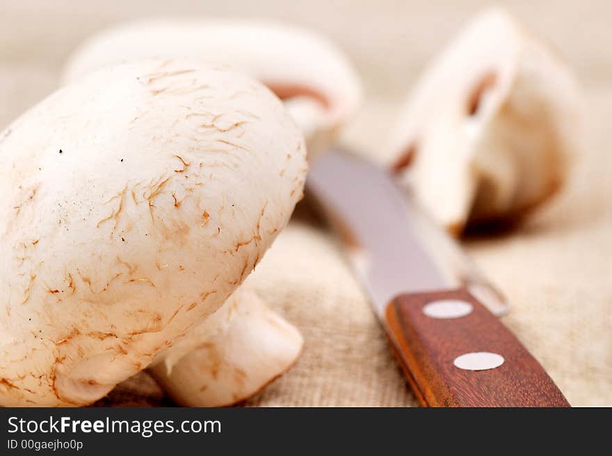 Mushrooms and knife on the table