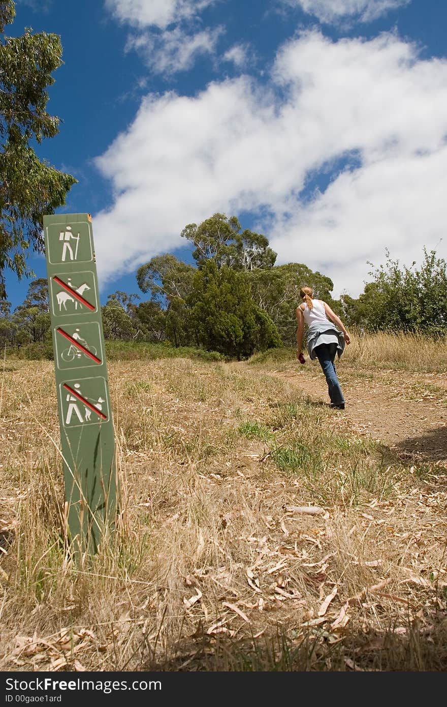 Young girl on a walking trail on a summer's day. Young girl on a walking trail on a summer's day