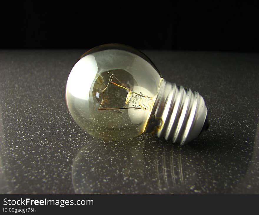 Light Bulb on Polished Granite