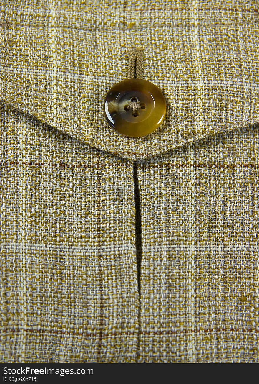 Closeup of jacket's pocket with button. Closeup of jacket's pocket with button