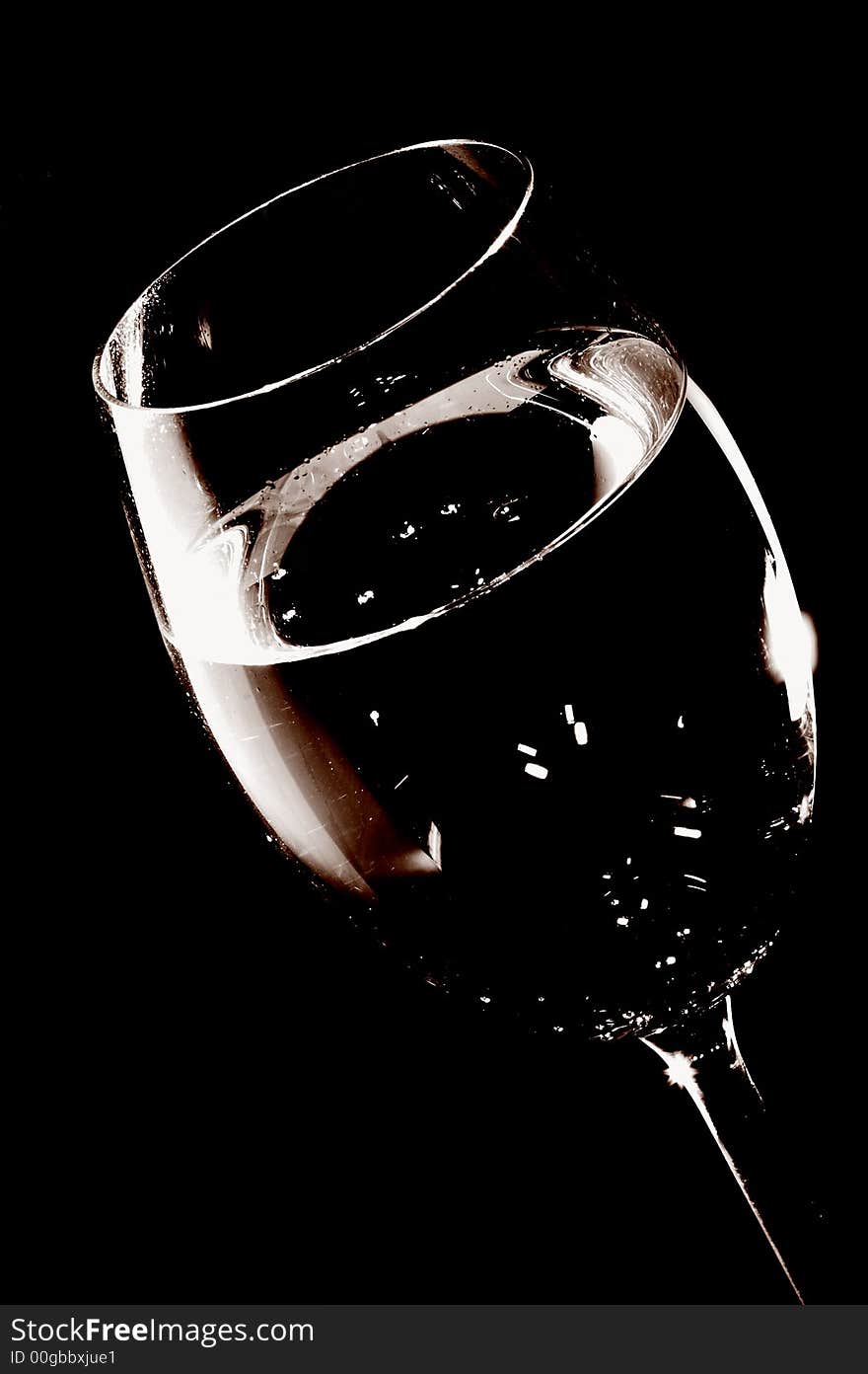 Tall wine glass over black background. Tall wine glass over black background