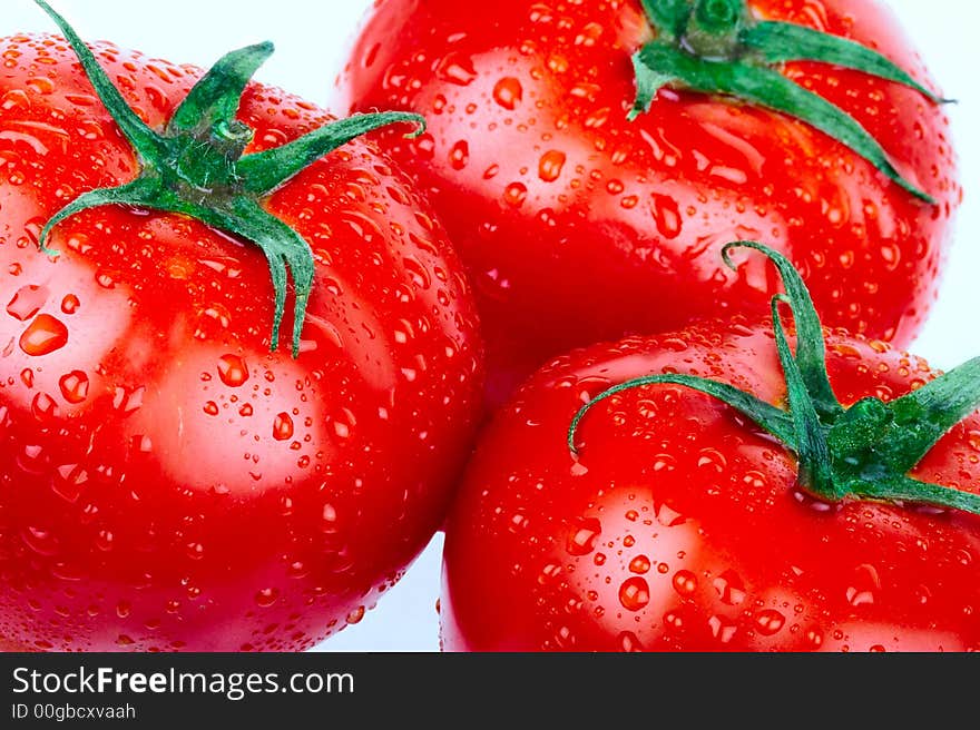 Red tomatoes. over white background