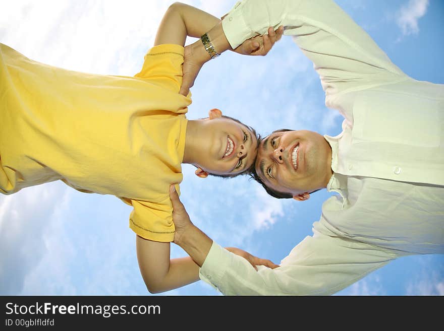 Father with child on a background of the sky