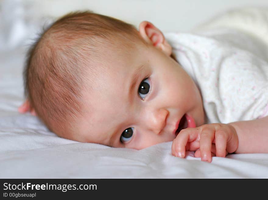 Cute 6 Months old mixed baby girl trying to stand up. Cute 6 Months old mixed baby girl trying to stand up