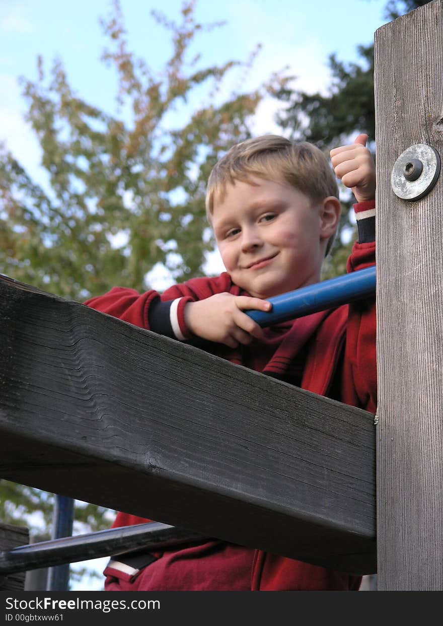 Boy with thumbs up and smirk on face. Boy with thumbs up and smirk on face.