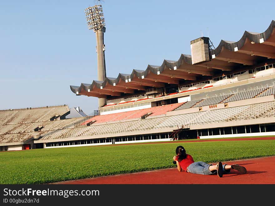 Girl taking photo in the stadium