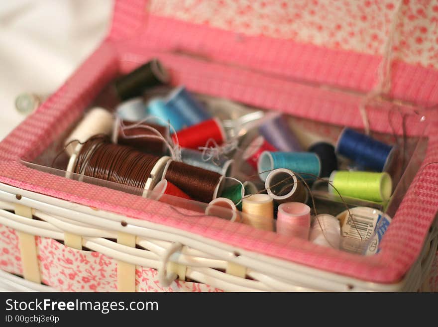 Thread Basket with many colored spools of thread. Thread Basket with many colored spools of thread