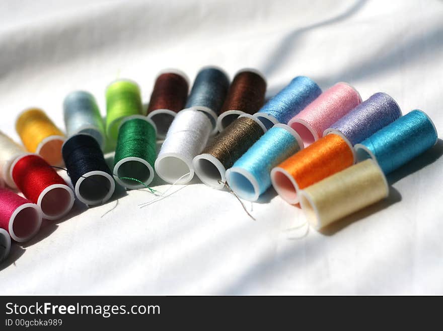 Rows of Different Colored Spools of Thread. Rows of Different Colored Spools of Thread