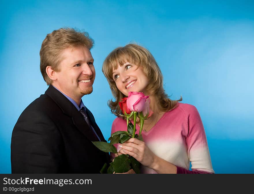 The man in a suit has presented the bouquet of flowers. The man in a suit has presented the bouquet of flowers