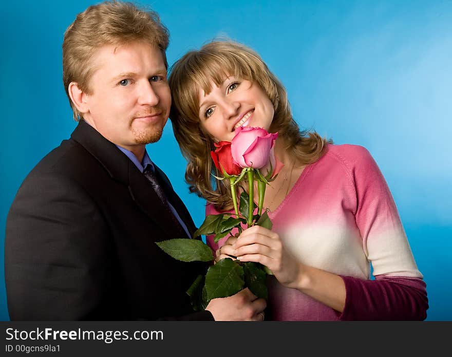 The man in a suit has presented the bouquet of flowers. The man in a suit has presented the bouquet of flowers