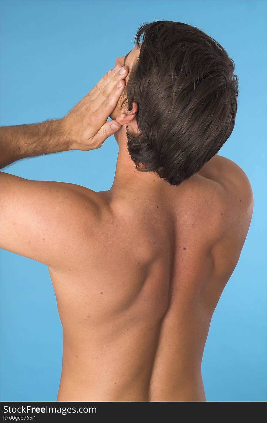 Close up of a young man back over blue background