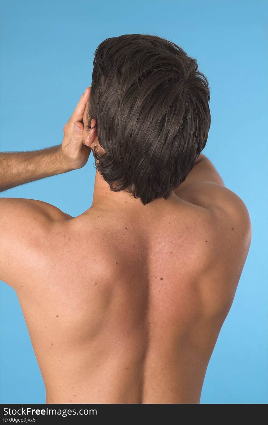 Close up of a young man back over blue background