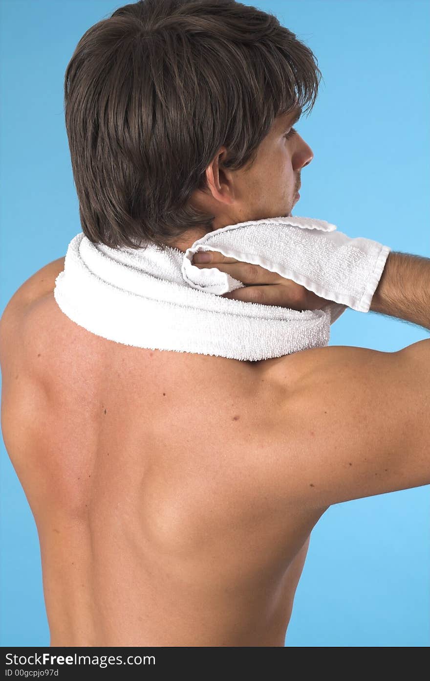 Close up of a young man back over blue background. Close up of a young man back over blue background