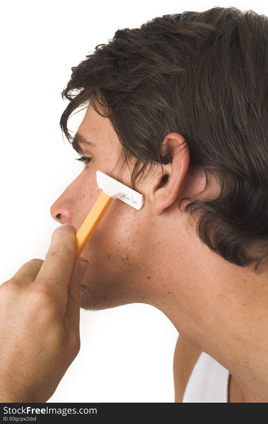 Close up of young man shaving over white background