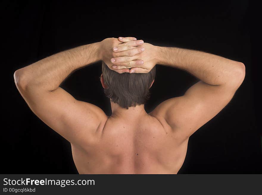 Close up of a young man back over black background