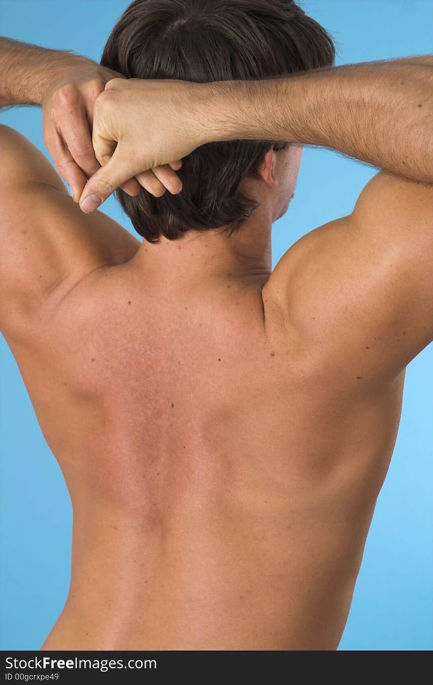 Close up of a young man back over blue background