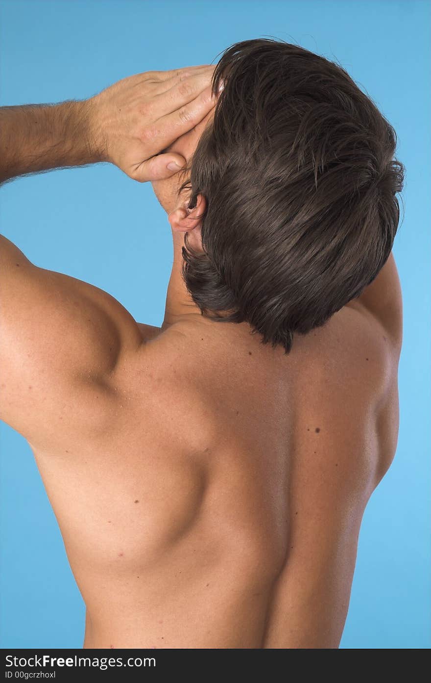 Close up of a young man back over blue background