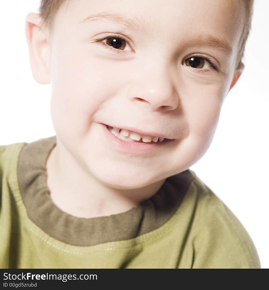 A beauty portrait taken from a young boy child in the studio. A beauty portrait taken from a young boy child in the studio