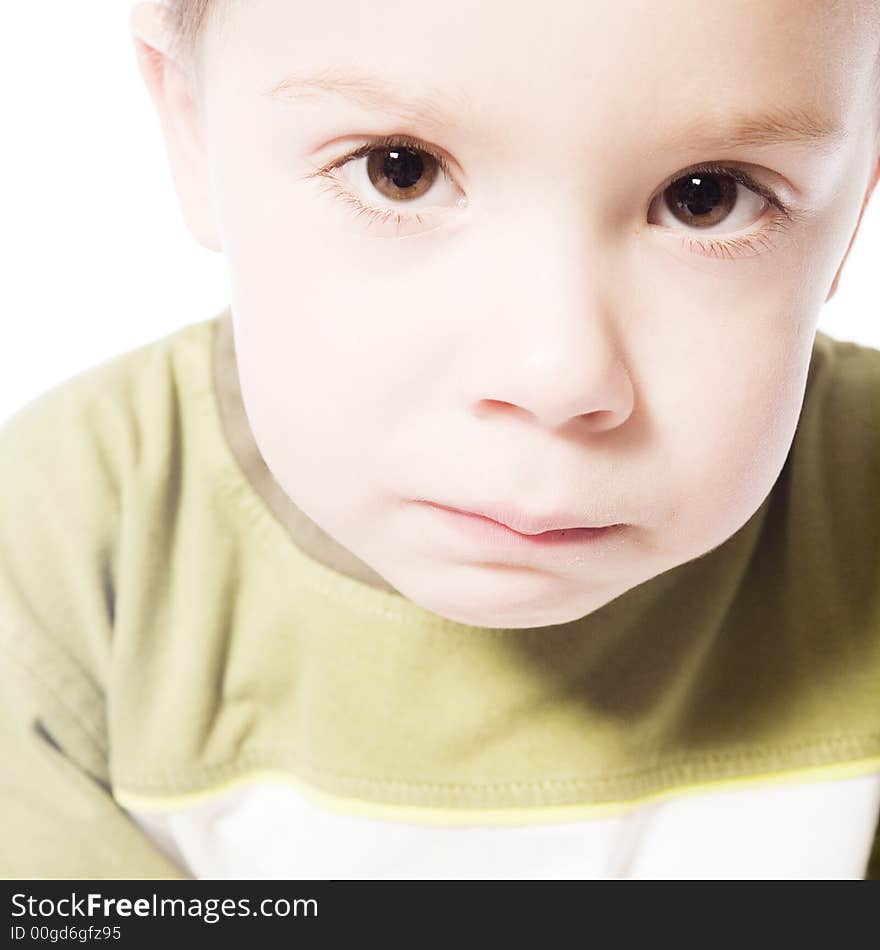 A beauty portrait taken from a young boy child in the studio. A beauty portrait taken from a young boy child in the studio