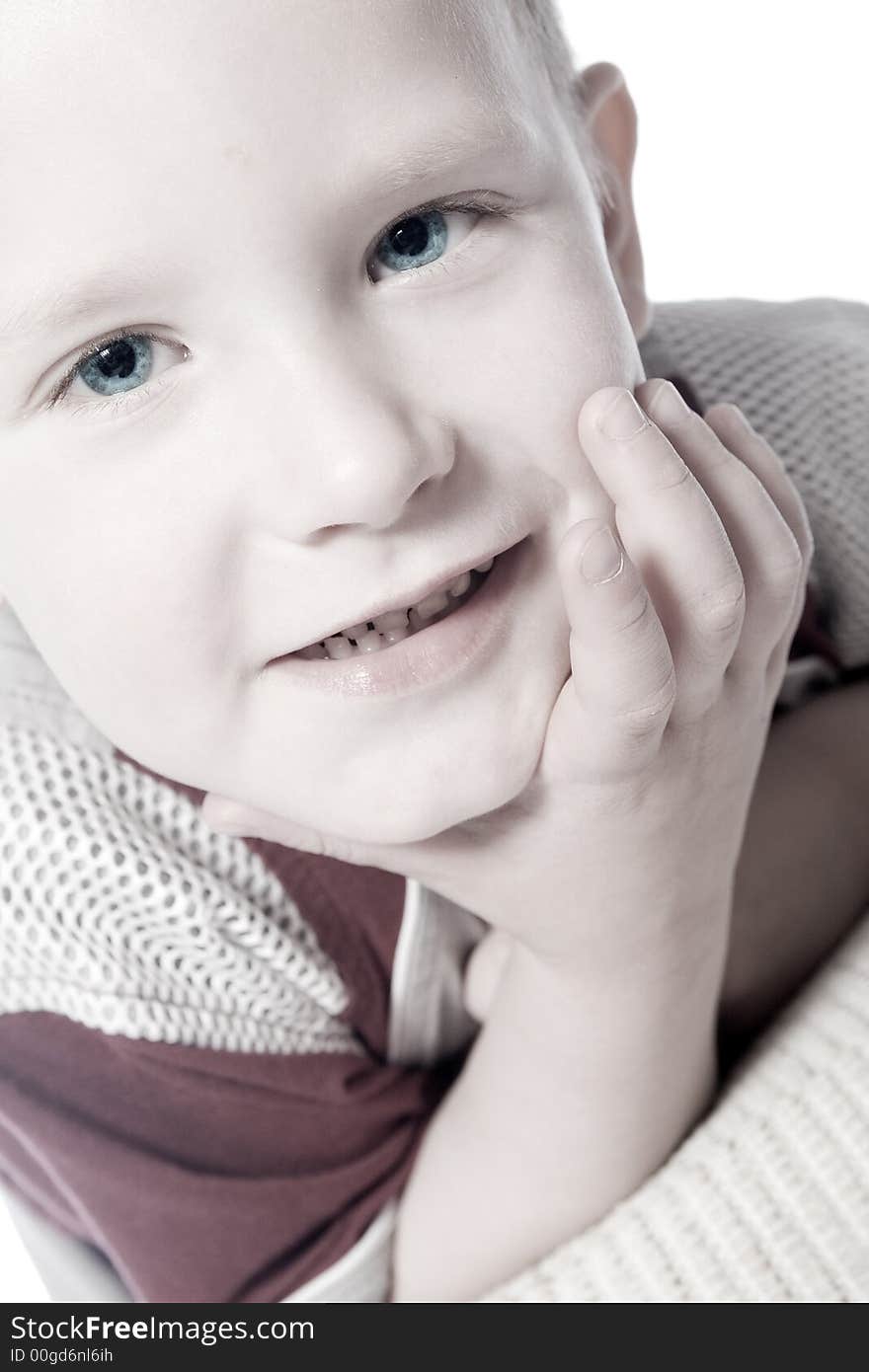 A beauty portrait taken from a young boy child in the studio. A beauty portrait taken from a young boy child in the studio