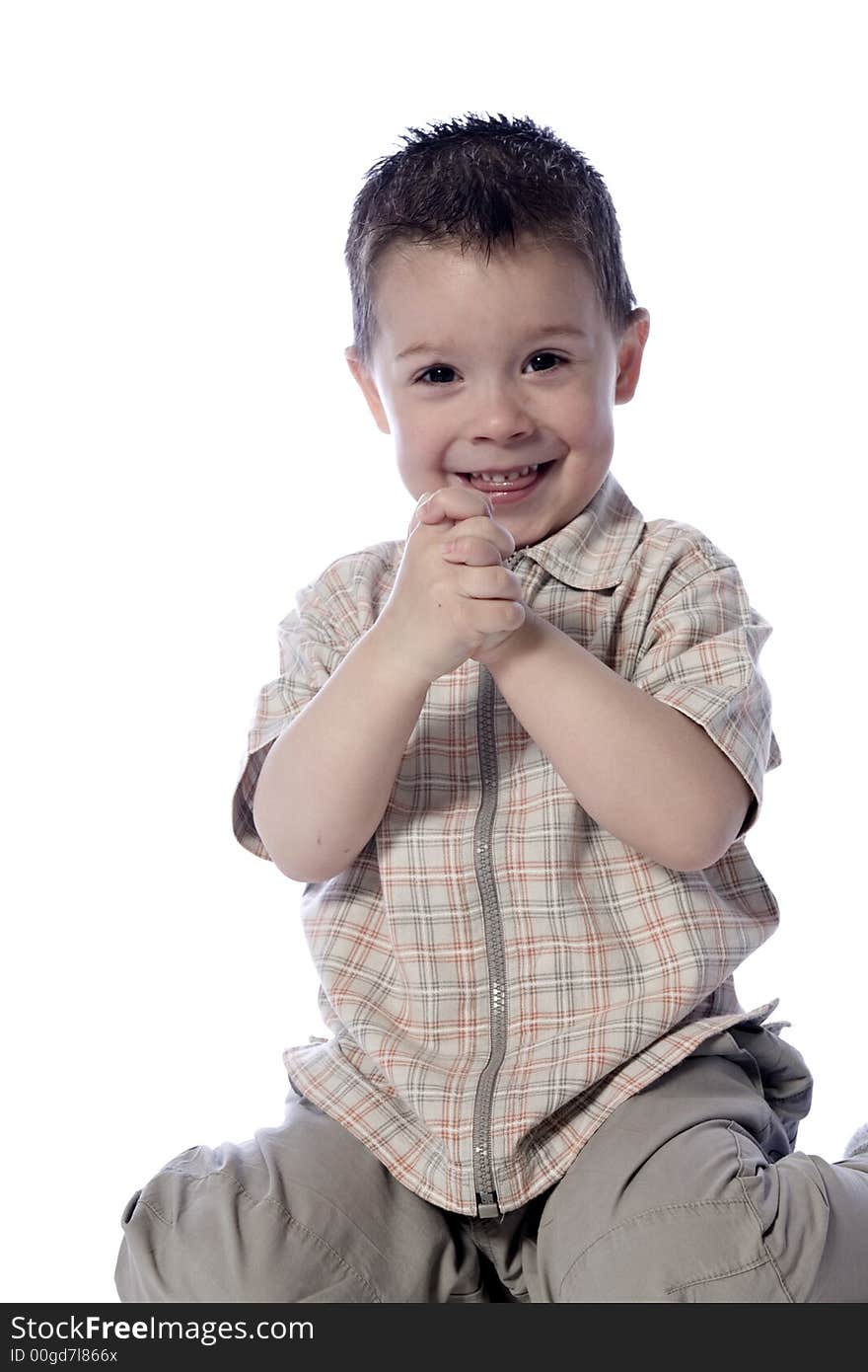 A beauty portrait taken from a young boy child in the studio. A beauty portrait taken from a young boy child in the studio