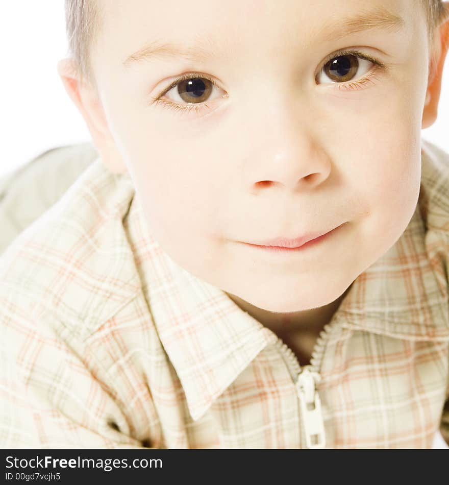 A beauty portrait taken from a young boy child in the studio. A beauty portrait taken from a young boy child in the studio