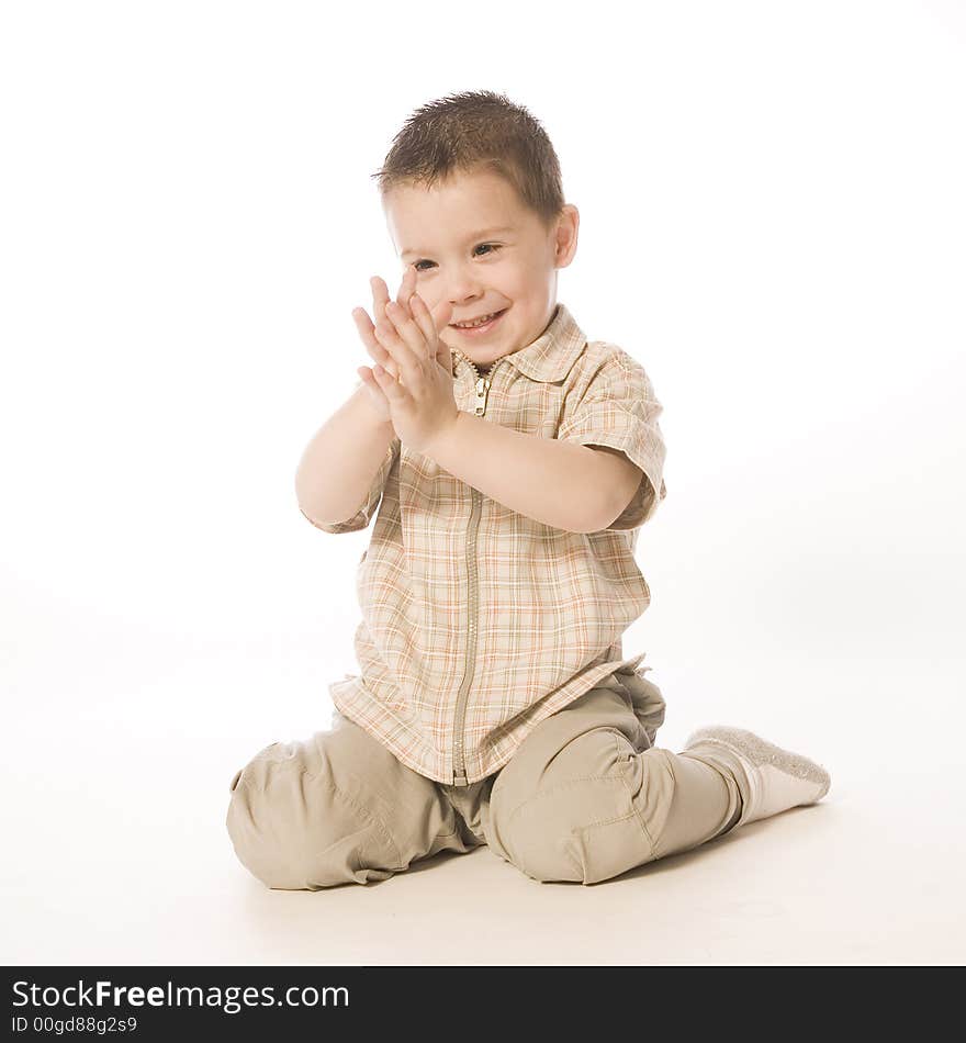 A beauty portrait taken from a young boy child in the studio. A beauty portrait taken from a young boy child in the studio