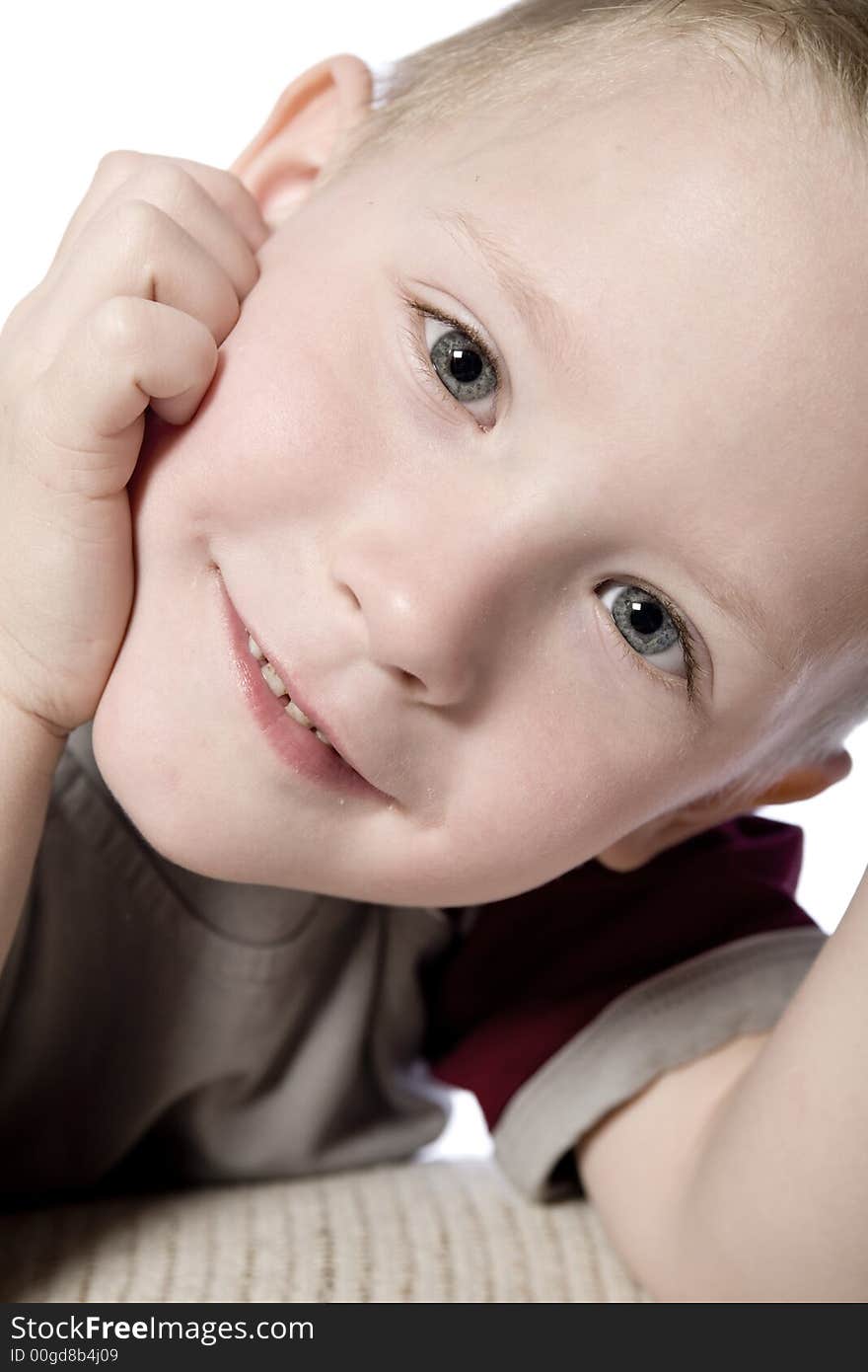 A beauty portrait taken from a young boy child in the studio. A beauty portrait taken from a young boy child in the studio