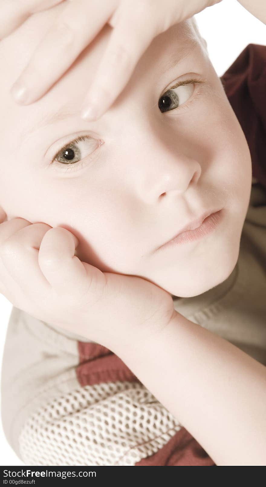 A beauty portrait taken from a young boy child in the studio. A beauty portrait taken from a young boy child in the studio