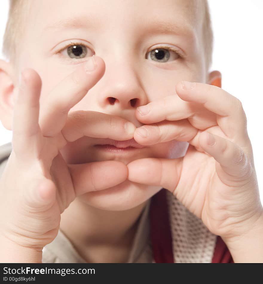 A beauty portrait taken from a young boy child in the studio. A beauty portrait taken from a young boy child in the studio