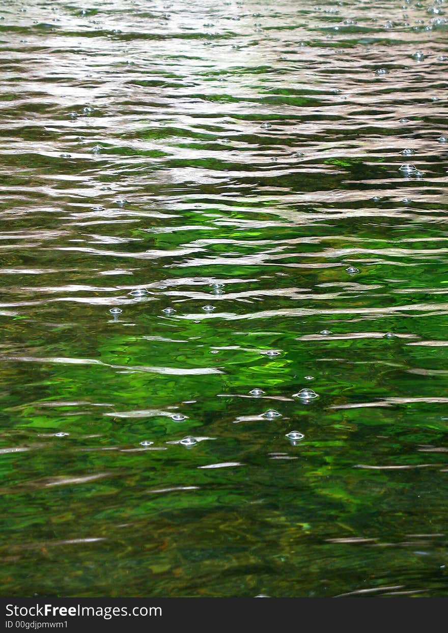 Portrait photo of a fresh water mountain pond. Portrait photo of a fresh water mountain pond.