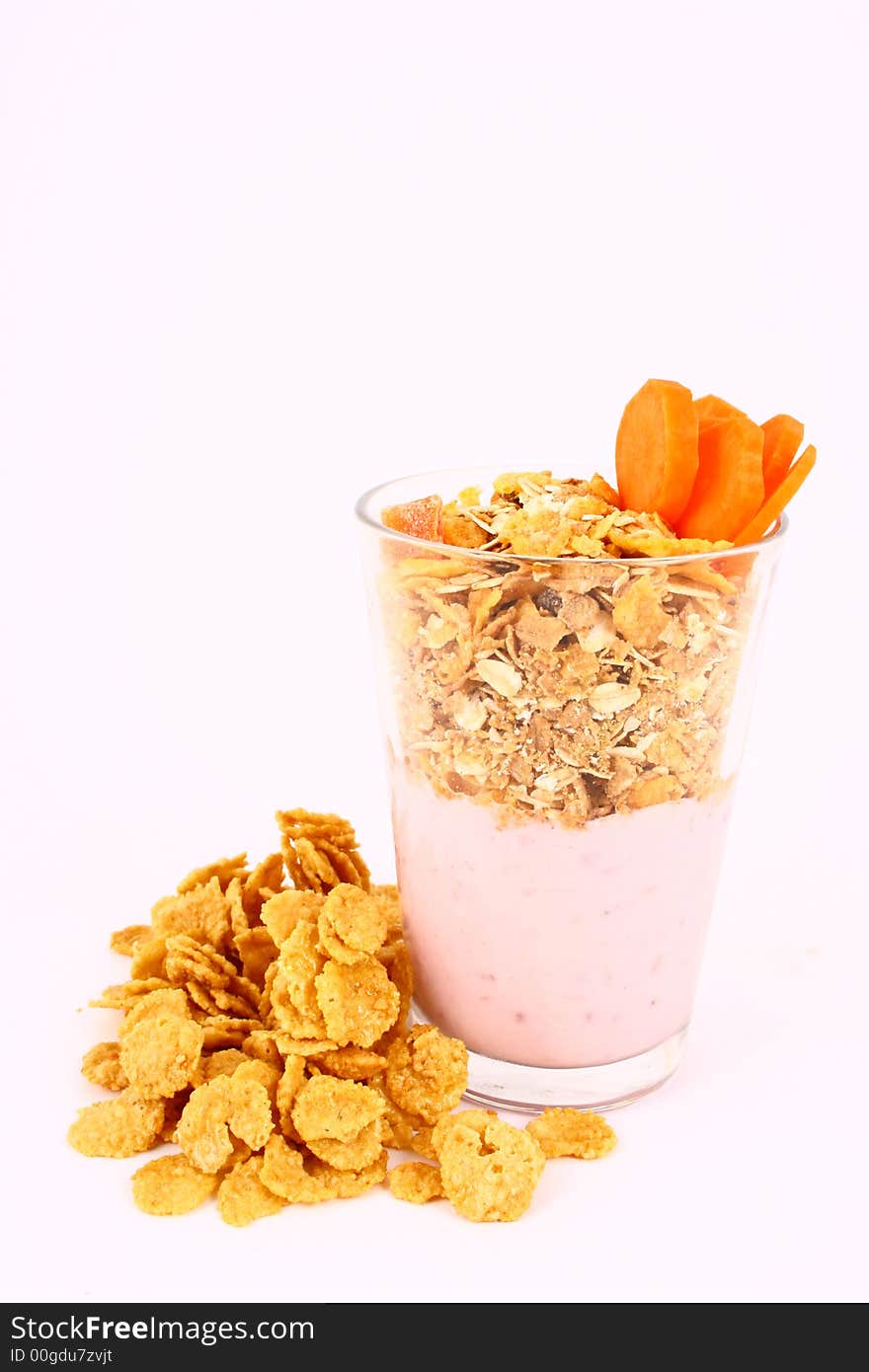 A bowl full of granola isolated on white background. A bowl full of granola isolated on white background