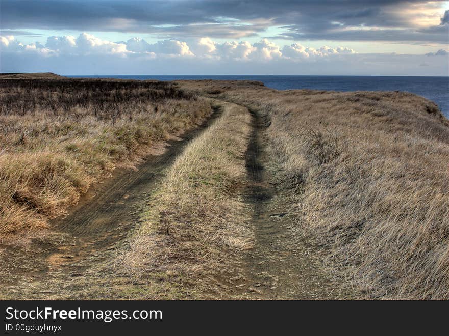 HDR photo of road along the ocean. Landscape orientation.