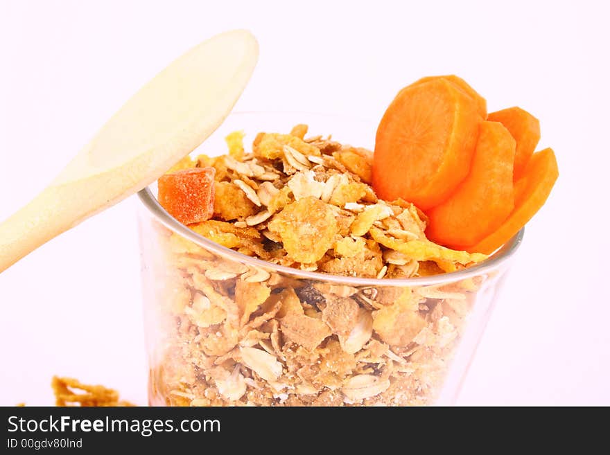 A bowl full of granola isolated on white background. A bowl full of granola isolated on white background