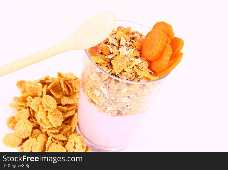 A bowl full of granola isolated on white background. A bowl full of granola isolated on white background