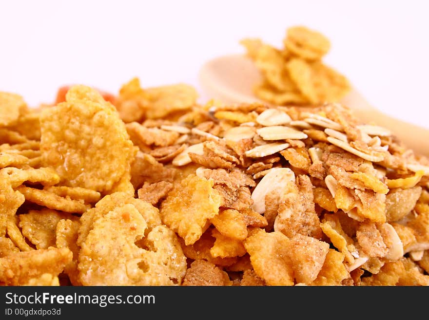 A bowl full of granola isolated on white background. A bowl full of granola isolated on white background