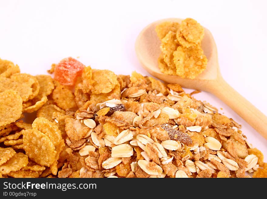 A bowl full of granola isolated on white background. A bowl full of granola isolated on white background