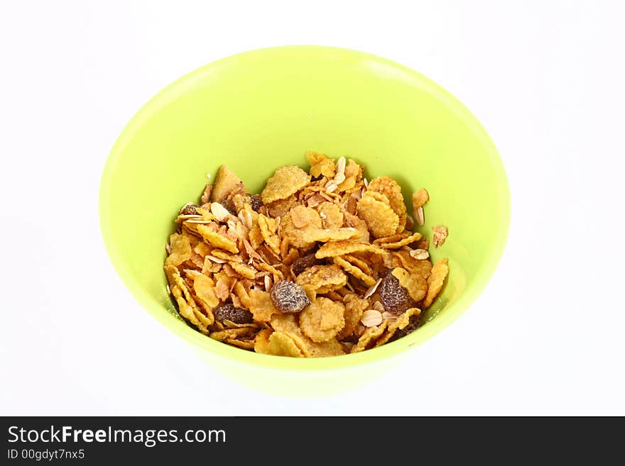 A bowl full of granola isolated on white background. A bowl full of granola isolated on white background