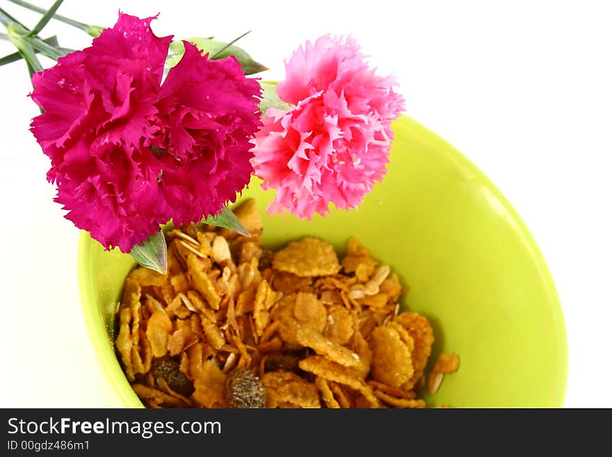 A bowl full of granola isolated on white background. A bowl full of granola isolated on white background