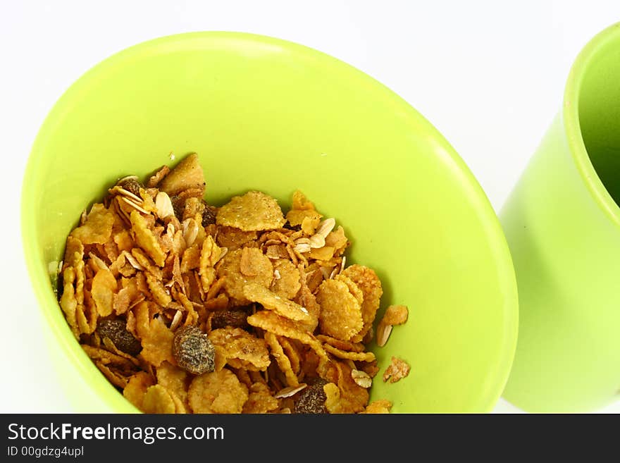 A bowl full of granola isolated on white background. A bowl full of granola isolated on white background