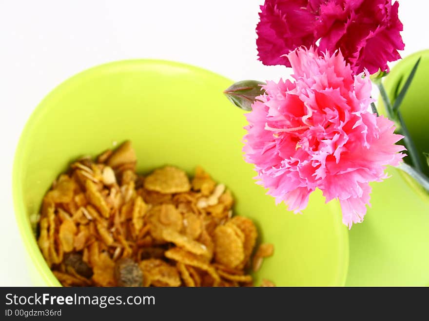 A bowl full of granola isolated on white background. A bowl full of granola isolated on white background