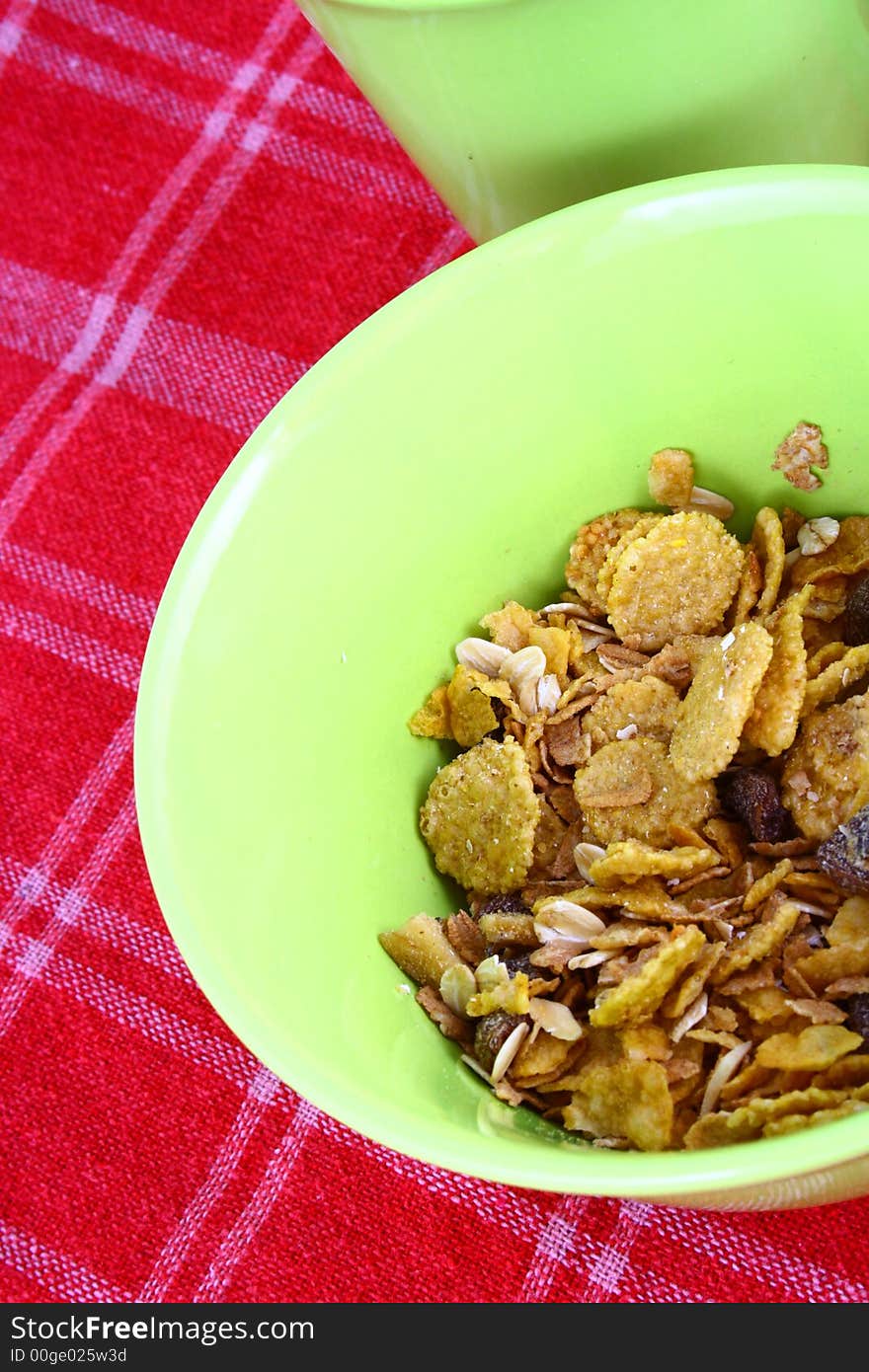 A bowl full of granola isolated on white background. A bowl full of granola isolated on white background