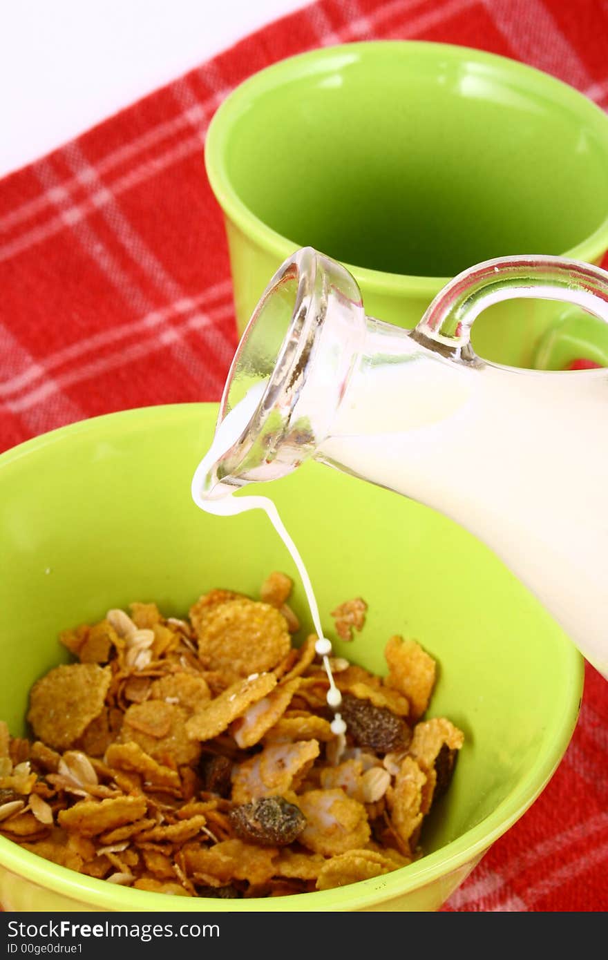 A bowl full of granola isolated on white background. A bowl full of granola isolated on white background