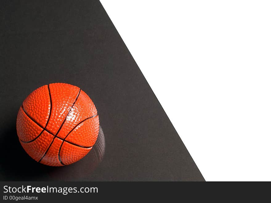 Basketball ball on glass with a black and white background