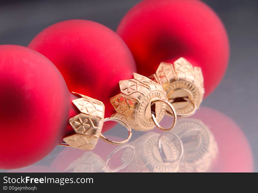 Three ball of red color, New Year's toy, dark background